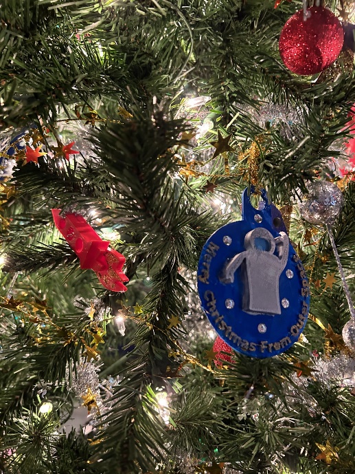 A christmas tree with ornamentsDescription automatically generated